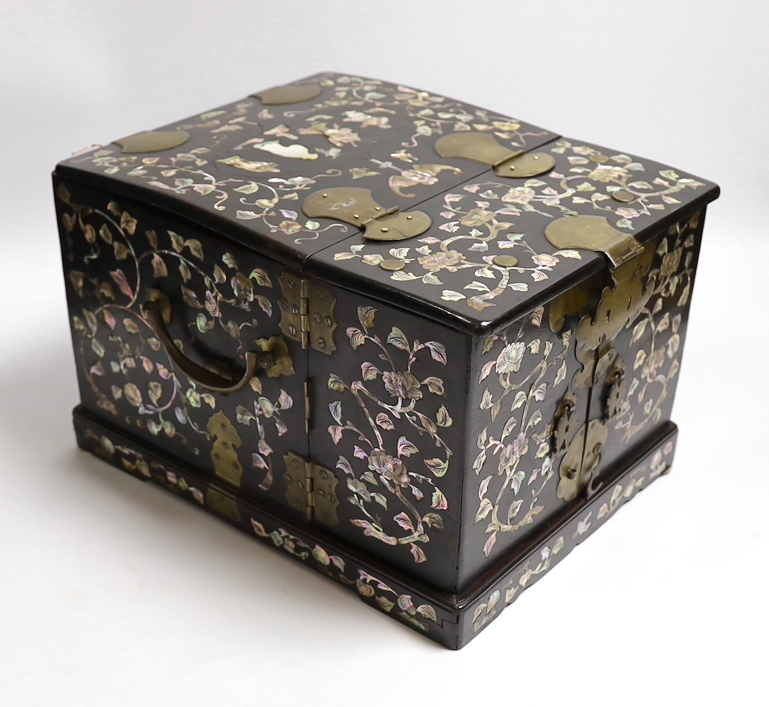 A Chinese mother-of- pearl inlaid hongmu vanity cabinet, late Qing dynasty, with fitted interior comprising a mirror, drawers, etc. 24cm x 31cm x 20cm